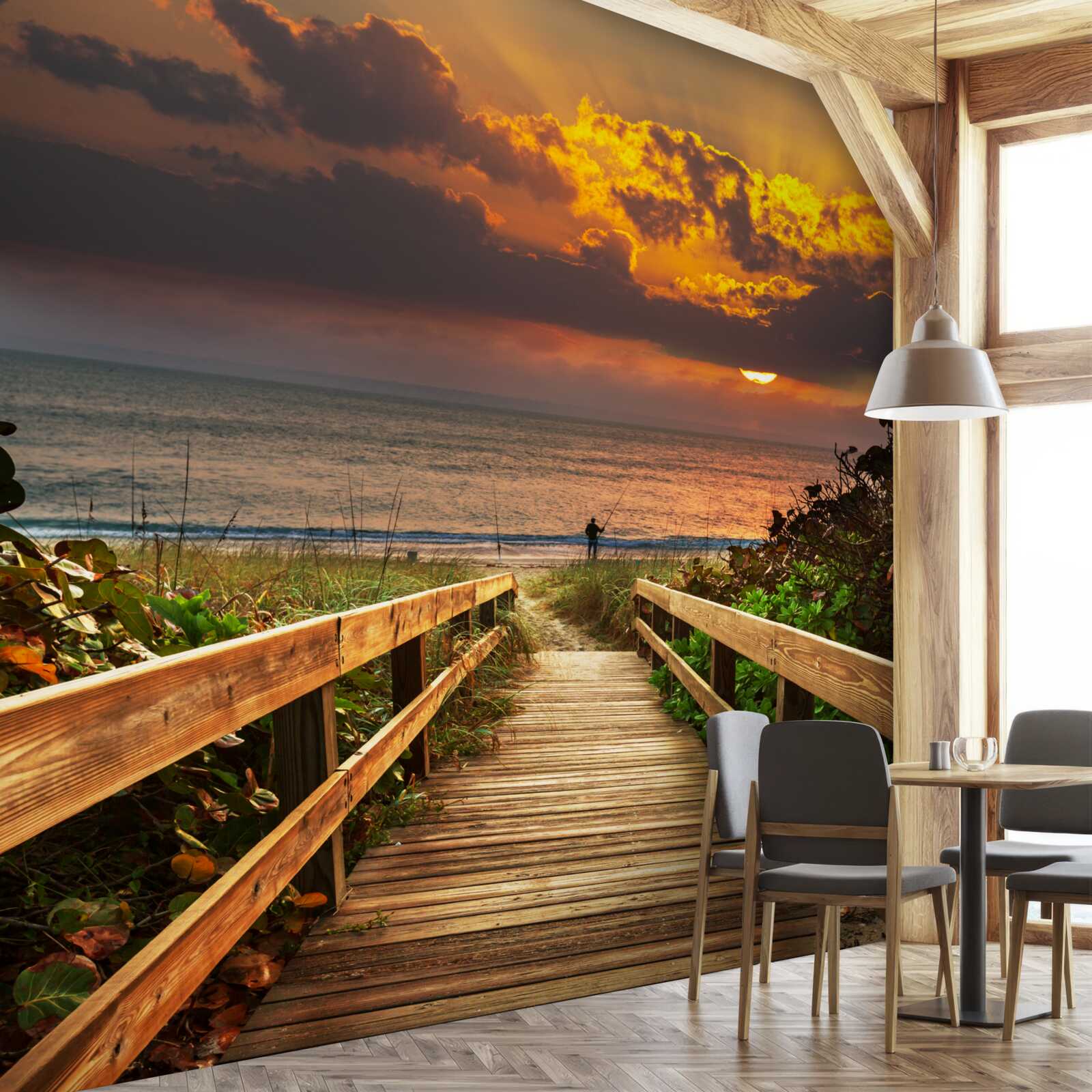 Fotobehang de zon gaat onder aan de horizon aan de kust