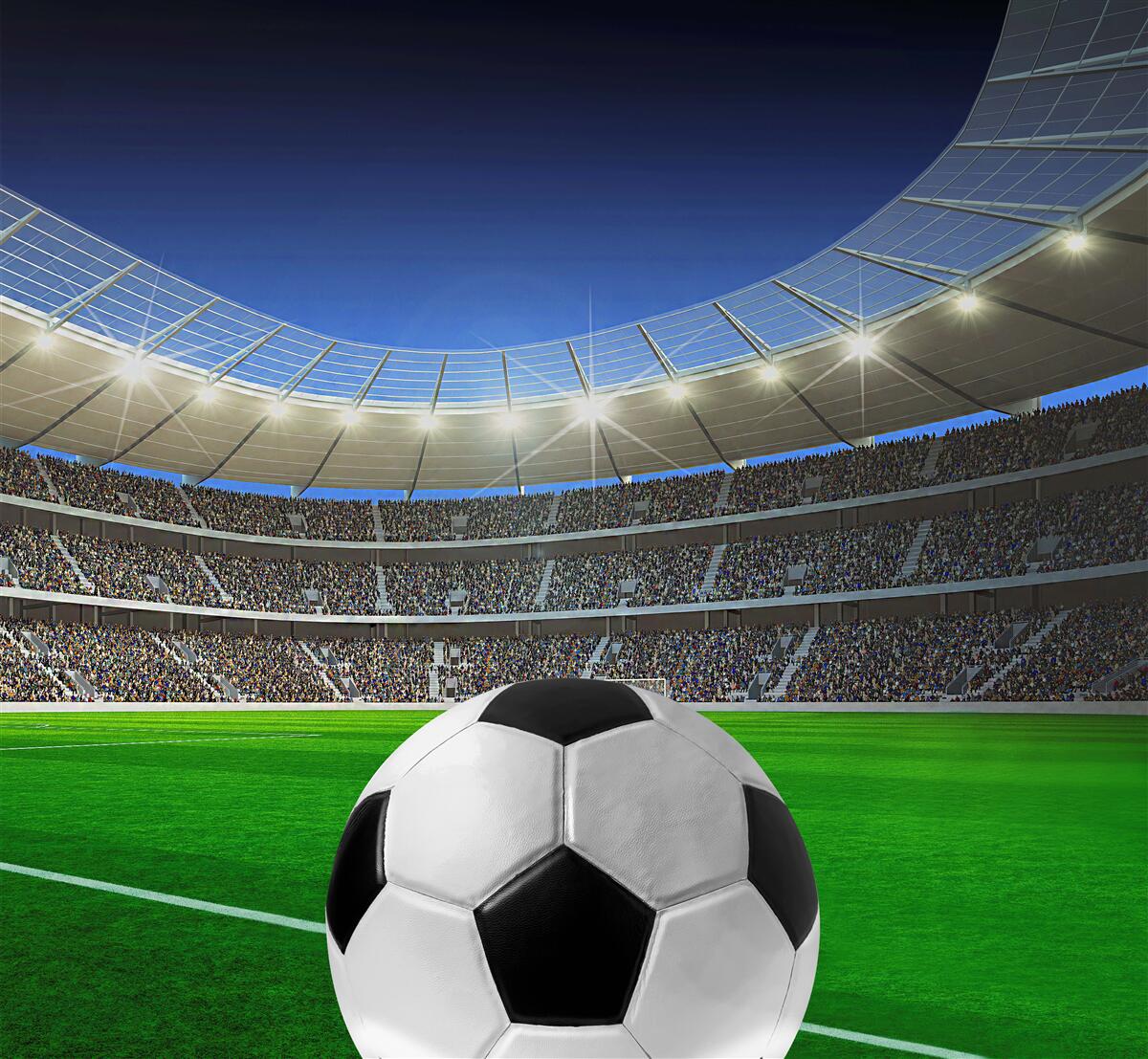 Fotobehang in de arena is er een voetbalveld met een bal