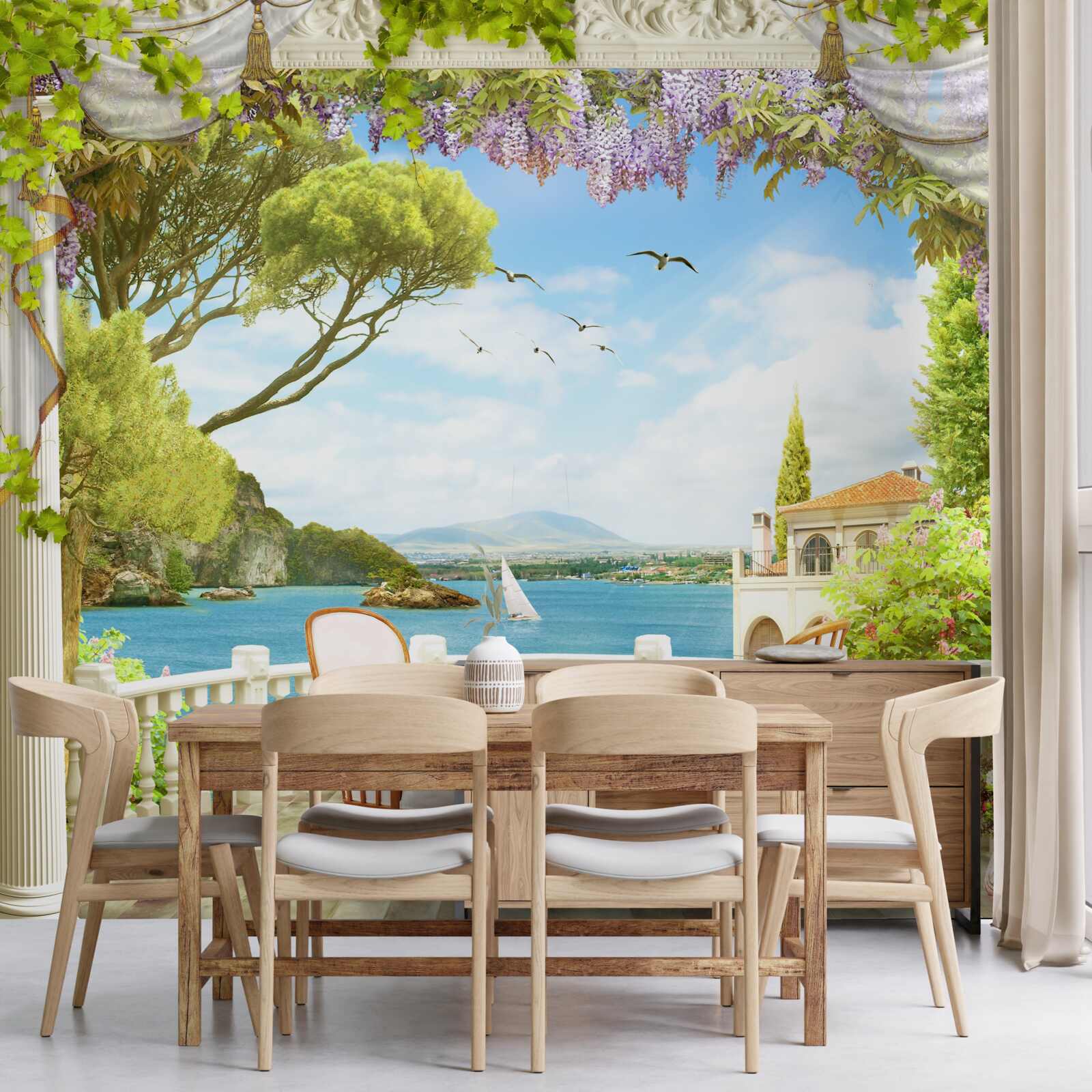 Fotobehang een paar stoelen met een tafel en uitzicht op de oceaan