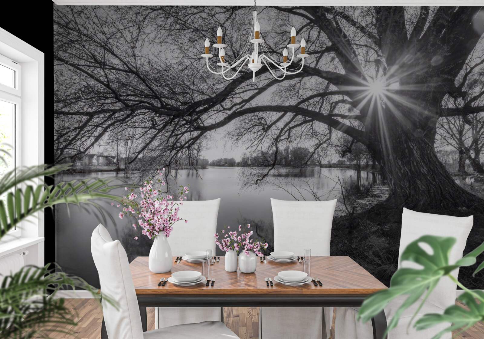 Fotobehang een zonnestraal prikt door de takken van een boom bij het water