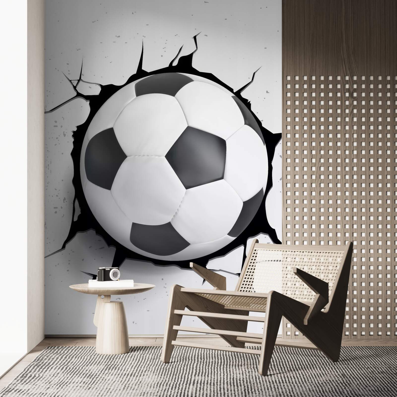Fotobehang een voetbal steekt uit de muur