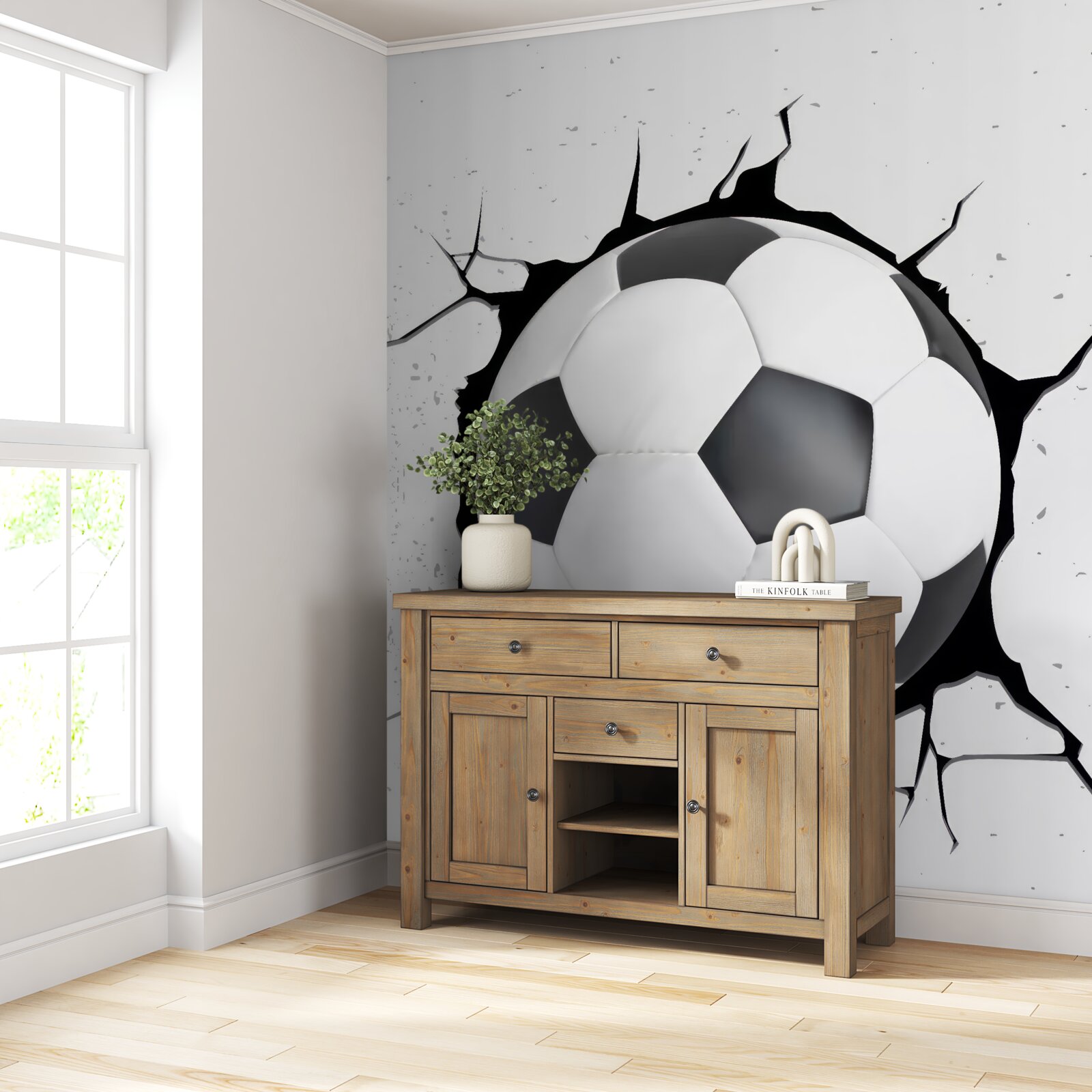 Fotobehang een voetbal steekt uit de muur