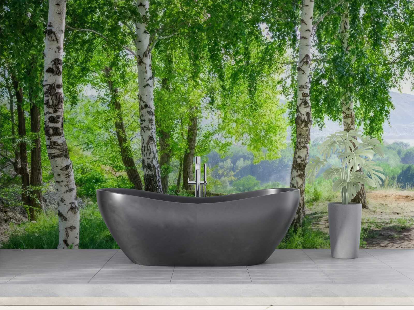 Fotobehang een bos vol groene berken